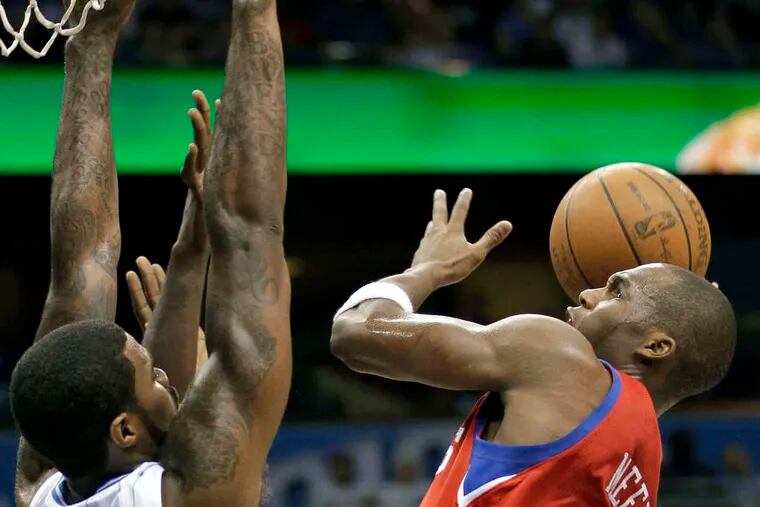 The Sixers' Jodie Meeks, shoot ing over the Magic's Earl Clark, has struggled with his shooting.