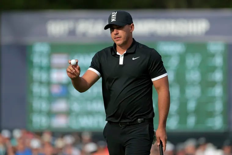Brooks Koepka reacts after putting on the 13th green during the third round of the PGA Championship golf tournament, Saturday, May 18, 2019, at Bethpage Black in Farmingdale, N.Y. (AP Photo/Julio Cortez)