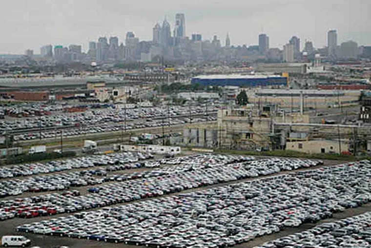 Nearly 800 cars are processed a day at the Pier 98 annex. The pressing need now is for more space to park cars, which do not leave until dealers want them in showrooms. (Michael Bryant/Staff)