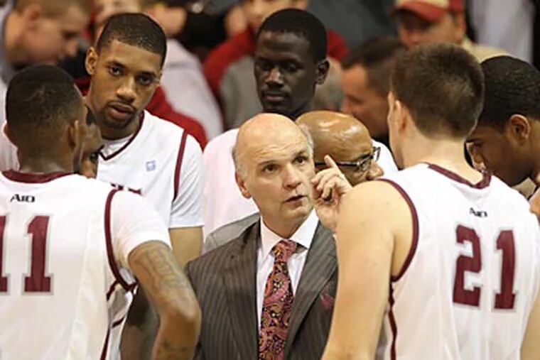 Phil Martelli tied the school record for most wins as a head coach in St. Joseph's 81-72 win over Coppin State. (Charles Fox/Staff Photographer)