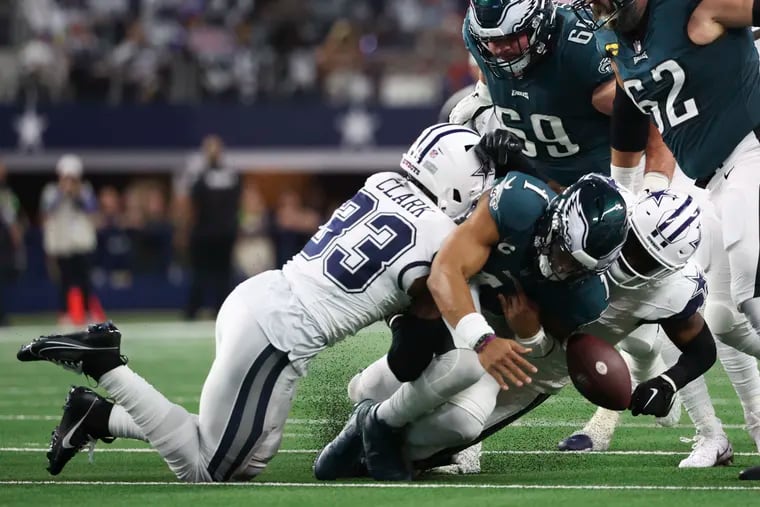 Eagles quarterback Jalen Hurts fumbles away the football during the first quarter against the Cowboys. It was the beginning of a rough night for the Eagles offense.
