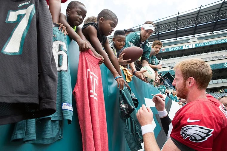 Philadelphia Eagle Carson Wentz signs autographs after Eagles practice
at Lincoln Financial Field.
