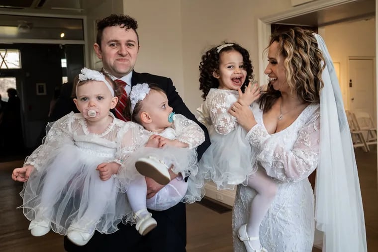 Samuel and Patricia Kolman and their three children at their wedding and baby-naming celebration at Abington Art Center.