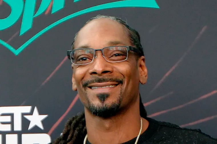 Snoop Dogg at the 2016 BET Hip Hop Awards in Atlanta. At The Fillmore Philadelphia Saturday, the rapper shot fake dollar bills with his face on them into the crowd and smoked a blunt the size of a ballpoint pen.