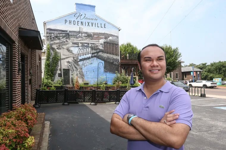 Phoenixville Mayor Peter Urscheler, poses in front of a mural in the borough on Thursday, August 16 , 2018.
