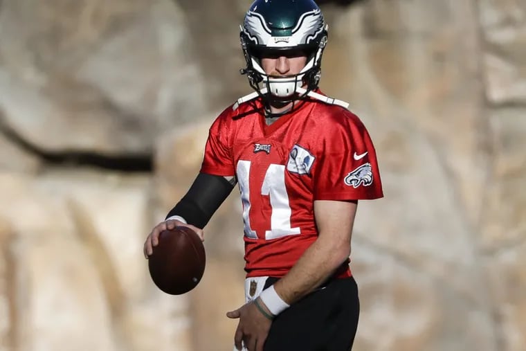 Eagles quarterback Carson Wentz holds the football during practice at the Angles Stadium of Anaheim in Anaheim, California on Thursday, December 7, 2017. YONG KIM / Staff Photographer