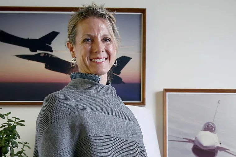 Former U.S. Air Force Maj. Heather Penney stands for a portrait in her office at the Mitchell Institute for Aerospace Studies, where she is currently a resident fellow, in Arlington, Va., on Tuesday, May 1, 2018. Penney was an Air Force lieutenant on September 11, 2001, when she was ordered to fly her F-16 fighter jet into the hijacked United Airlines Flight 93 to stop it from reaching Washington, D.C. TIM TAI / Staff Photographer