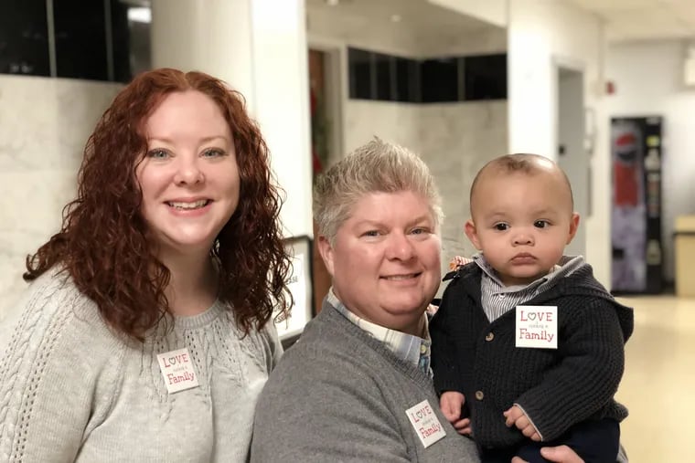 Sara and Dion with Bodhi at his adoption finalization, December 31, 2018.