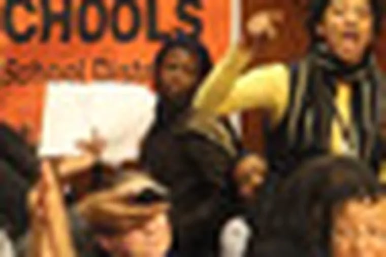 Parents, teachers, and concerned citizens turned out for a meeting of the Chester Upland School Board to show their concern for the school district which is in a dire financial situation. Tina Johnson, center, vents her feelings to the school board.  ( Charles Fox / Staff Photographer )  SVIGIL13P, 01/12/2012, Chester Upland School District Administration Building, 17th and Melrose Ave., Chester, PA