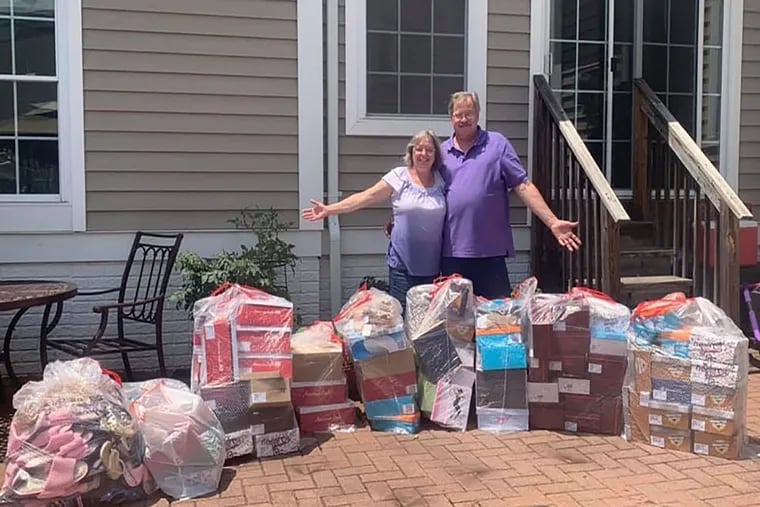 Susan Cook and Patrick Riordan with the 247 pairs of shoes they bought at a closing Payless Shoe and have donated to Womanspace, which provides shelter and services to survivors of domestic and sexual violence. HANDOUT/RACHEL BETHEA