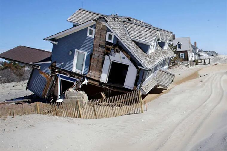 Homes in Mantoloking, Ocean County, severely damaged last October by Hurricane Sandy. A newly formed nonprofit, nonpartisan group put the price tag of Hurricane Sandy at more than $70 billion, with half of the damage sustained in New Jersey.
