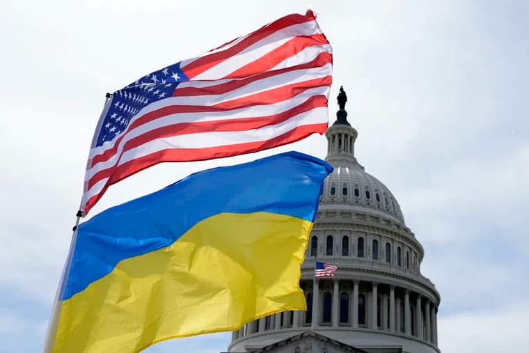 The American and Ukrainian flags wave outside of the U.S. Capitol on Tuesday in Washington. Partisan politics got in the way of aiding Ukraine, writes the Editorial Board, hurting gains Kyiv had made against its Russian invaders.