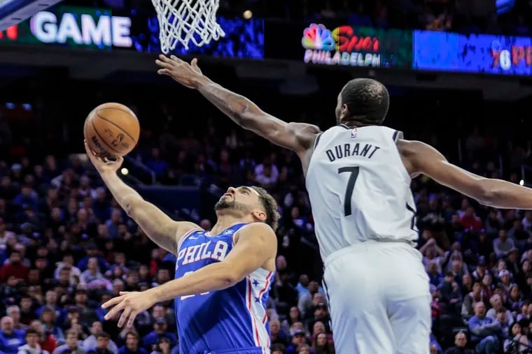 Sixers forward Georges Niang shoots over the Brooklyn Nets' Kevin Durant during a game at the Wells Fargo Center in Philadelphia, Tuesday, November 22, 2022.