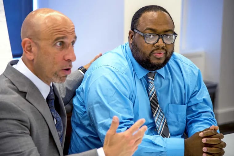 Khanefah Boozer (right) sits with his attorney Robert J. Levant on May 10, 2018, in the Center City offices of Feldman Shepherd Wohlgelernter Tanner Weinstock Dodig LLP.