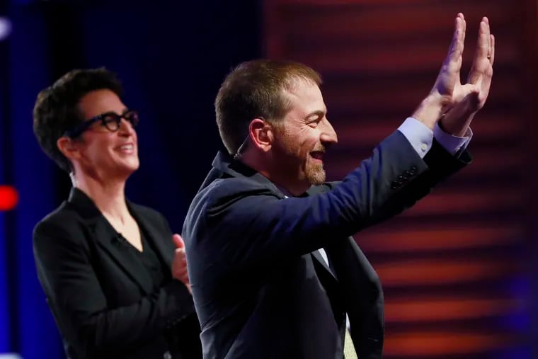 Chuck Todd, NBC News Political Director, and Rachel Maddow, MSNBC host, call for a pause during a Democratic primary debate hosted by NBC News at the Adrienne Arsht Center for the Performing Art, Wednesday, June 26, 2019, in Miami. (AP Photo/Wilfredo Lee)