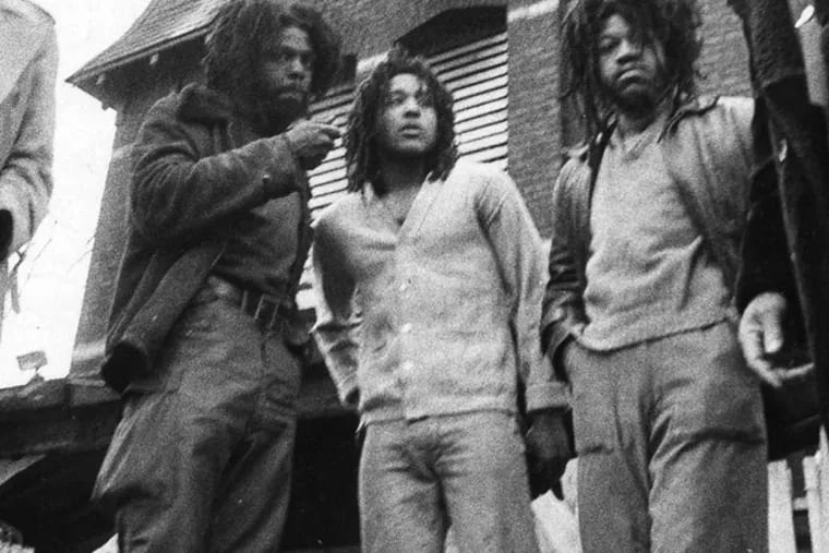 MOVE members William Phillips Africa (left), Charles Sims Africa, and Delbert Africa in March 1978. In August that year, shots broke out when police tried to evict the group, and an officer died.