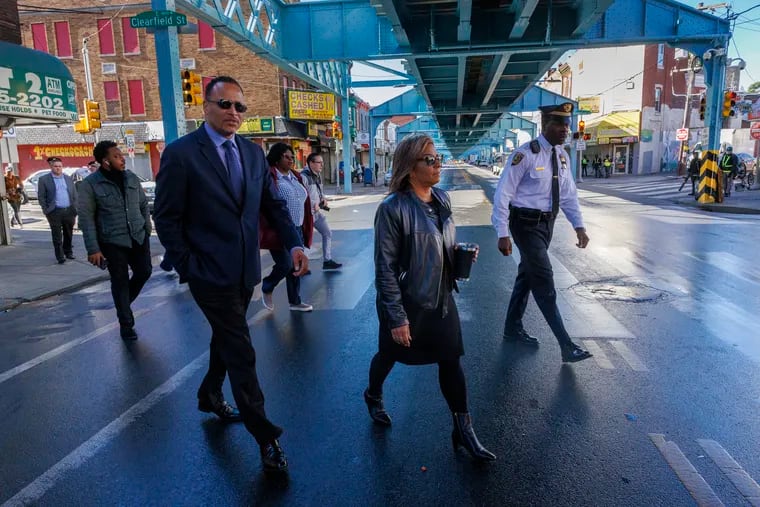 At left is Kenneth A. Divers, SEPTA, Director of Outreach Programs walking across Kensington Avenue with Quetcy Lozada. Councilmember Lozada held a press conference in October about neighborhood clean up and the opioid epidemic in Kensington.