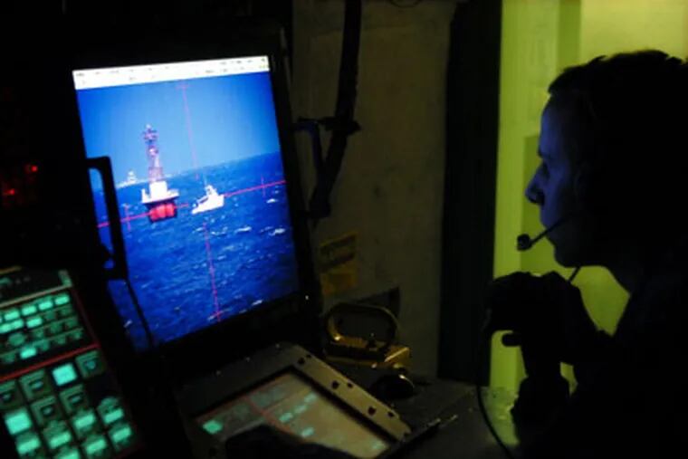 Inside the Aegis combat information center of the USS Wayne E. Meyer (DDG-108), Seaman Tyler Hill, 21, of Laurens, S.C. monitors pleasure craft and bouys on the Delaware River. ( Tom Gralish / Staff Photographer )