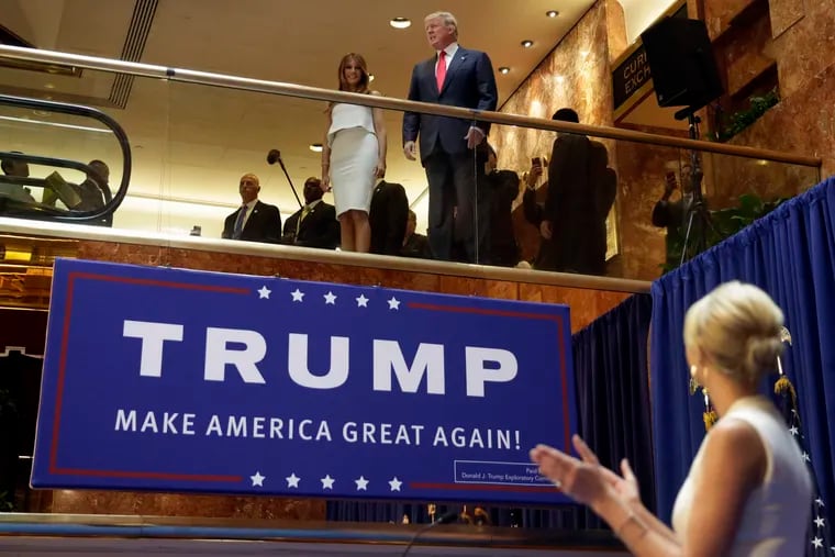 Donald Trump, accompanied by his wife, Melania, is applauded by his daughter Ivanka Trump, right before his announcement in June 2015 at Trump Tower that he was running for president.