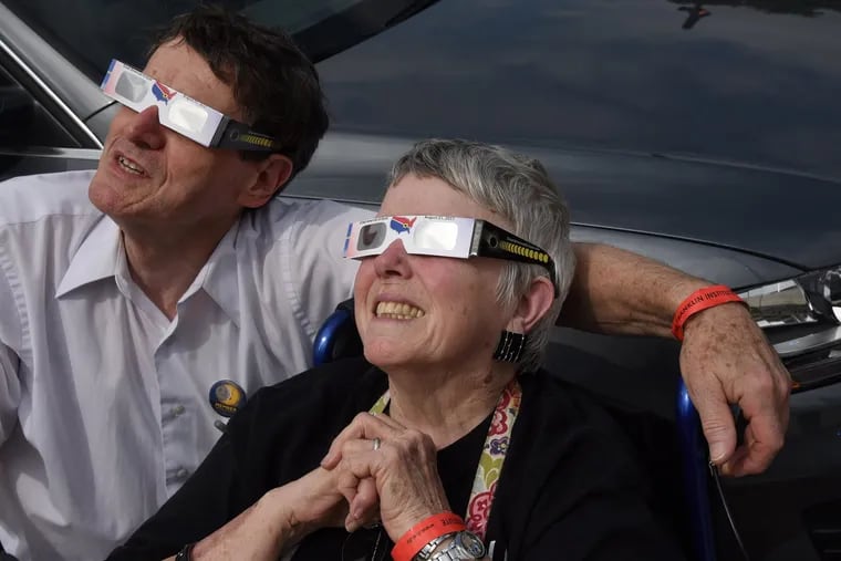 A couple watches the 2017 eclipse on the Parkway.