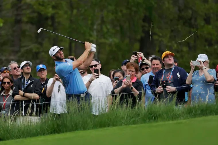 Dustin Johnson hits out of the rough on the sixth hole during the second round of the PGA Championship golf tournament, Friday, May 17, 2019, at Bethpage Black in Farmingdale, N.Y. (AP Photo/Julio Cortez)