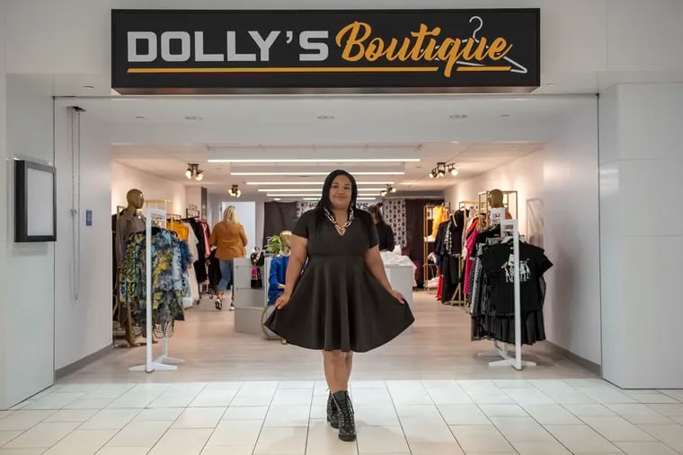 Shani Newton, 44, the owner of Dolly's Boutique, stands in front of her story at the Fashion District in Philadelphia, PA, on Friday, Oct. 18, 2019.