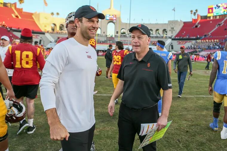 USC offensive coordinator Graham Harrell (left) during a game against UCLA.