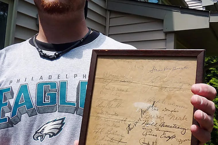 Michael O’Hara of Mantua, N.J., owns a bedcheck sheet signed by 37 members of the 1947 NFL champion Eagles.