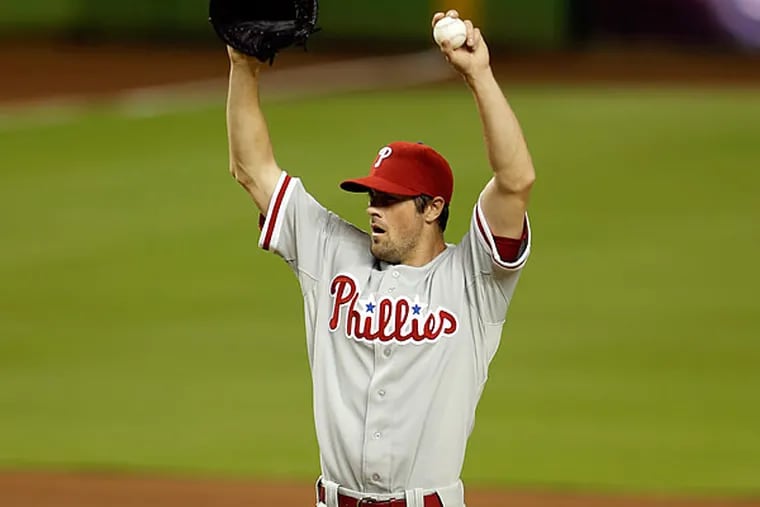 Cole Hamels didn't show up for the postgame interview, but his offense, except for Domonic Brown, failed to make an appearance in nine innings. (Lynne Sladky/AP)