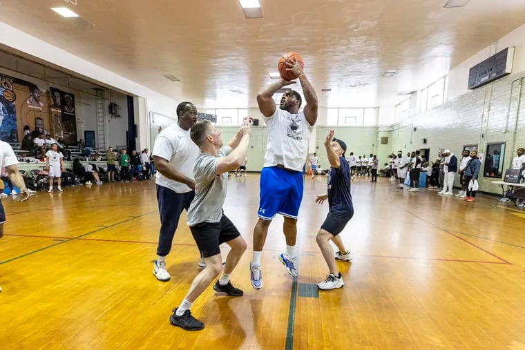 Neal Leonard, 30, of Germantown, Pa., goes for a shot during the inaugural 3 on 3 Gun Violence Reduction Basketball Tournament at the Belfield Recreation Center in Philadelphia, Pa., on Saturday, April 27, 2024.
