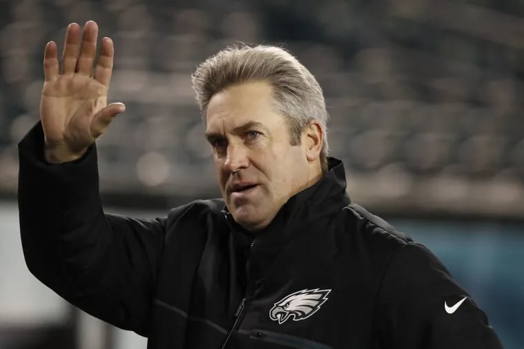 Eagles coach Doug Pederson waves to fans before a game last December.