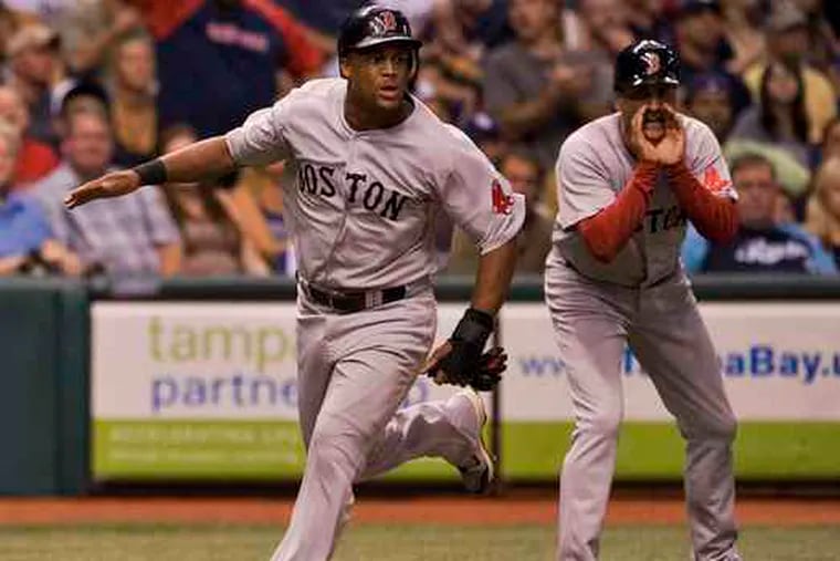 The Red Sox' Adrian Beltre rounds third to score against Tampa Bay. He played hurt on Sunday.