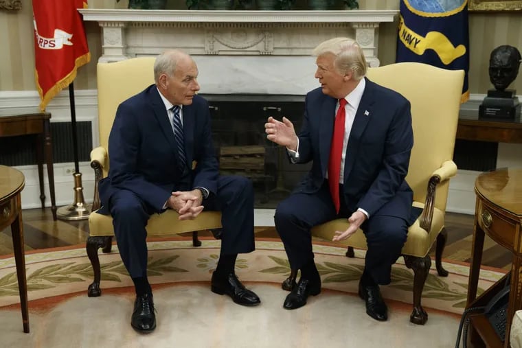 President Trump speaks with new White House Chief of Staff John Kelly (left) after he was sworn in Monday.