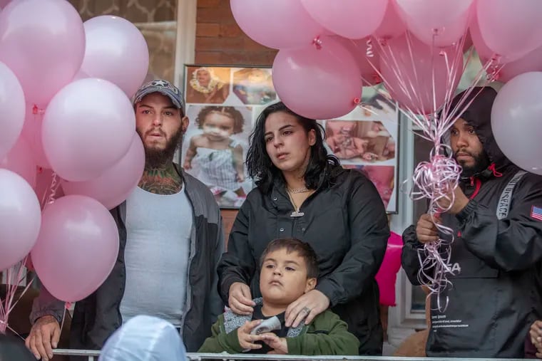 Joan Ortiz, center, the mother of 2-year-old Nikolette Rivera, who was fatally shot in a botched drug shooting in Kensington in October 2019.