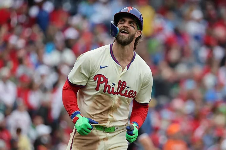 Bryce Harper reacts after hitting a sacrifice fly in the fourth inning on Sunday.