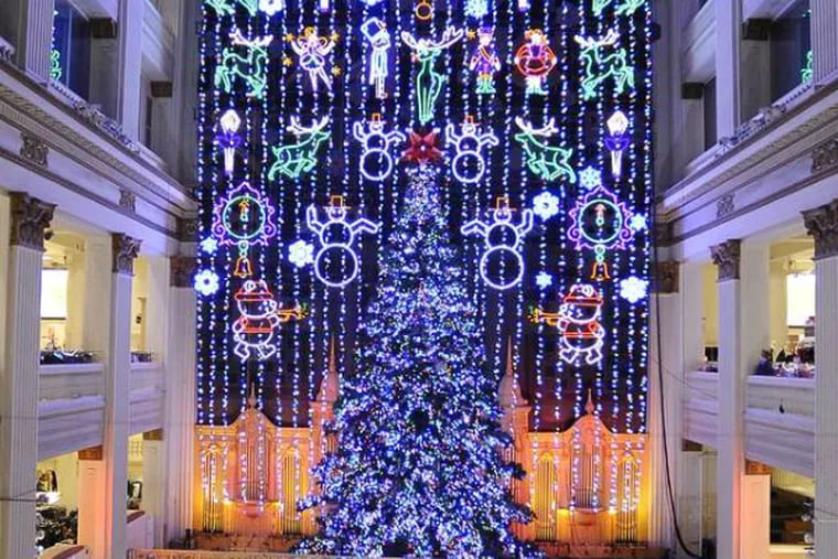The Macy's Christmas Light Show draws shoppers to Center City.