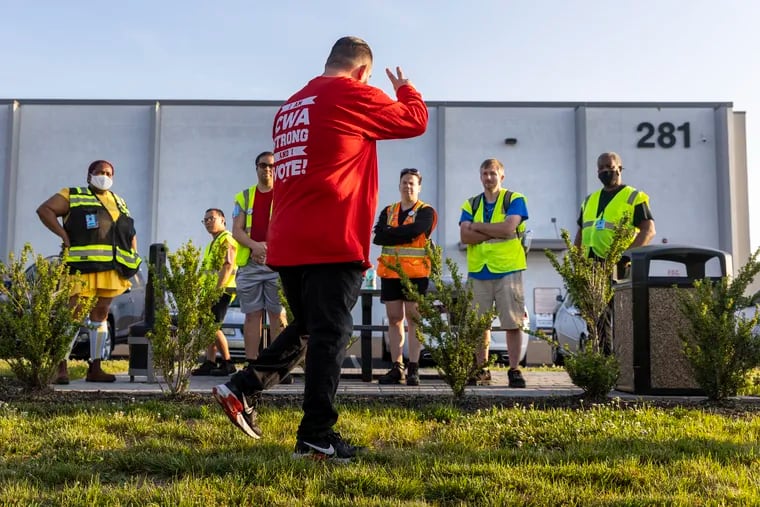 Garren Steiner, President of CWA Local 1014 made statement of support for Amazon workers.  Workers gather in protest outside the Amazon facility in Bellmawr on Wednesday morning. Amazon is closing this facility and moving employees to other locations.