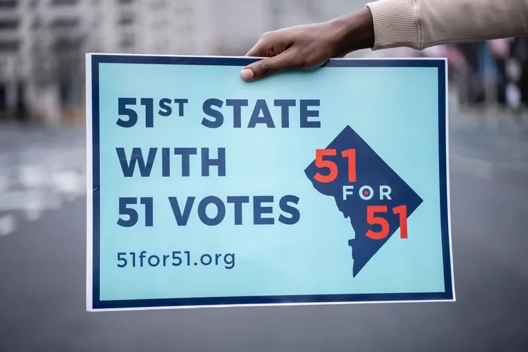 A sign describes the mission of 51 for 51. The organization's platform argues that a simple Senate majority of 51 votes should be sufficient to make D.C. the 51st state.