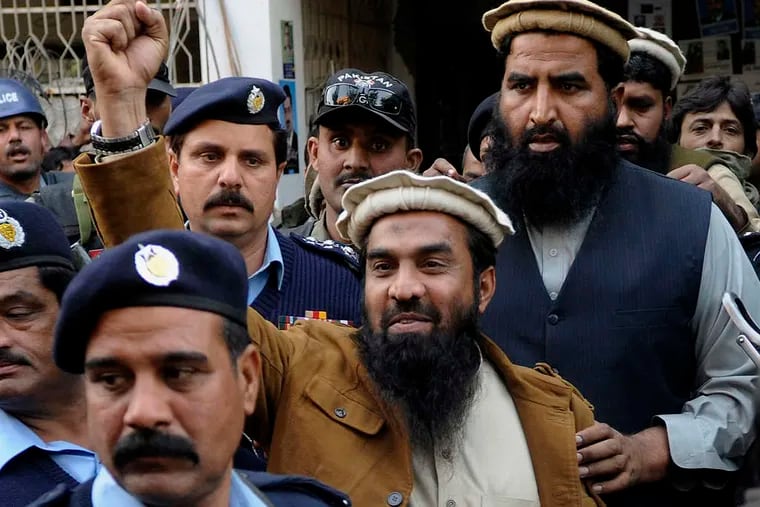 Zaki-ur-Rahman Lakhvi, the main suspect in the 2008 Mumbai attacks, raises his fist in January in Islamabad. A Pakistani court on Friday ordered his release.