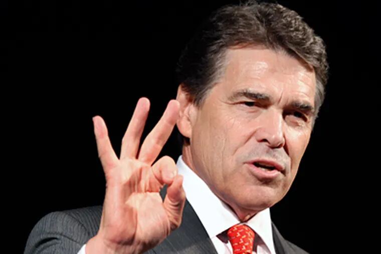Texas Gov. Rick Perry. By Monday, he was softening his “Ponzi scheme” talk. (Steve Helber / Associated Press)