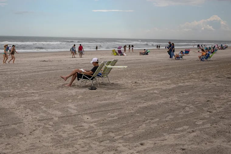 Beachgoers setup along the beach at a safe social distance while enjoying the weather at Margate City Beach on Saturday, May 23, 2020. The Jersey Shore opens up for the first holiday weekend amid the coronavirus.