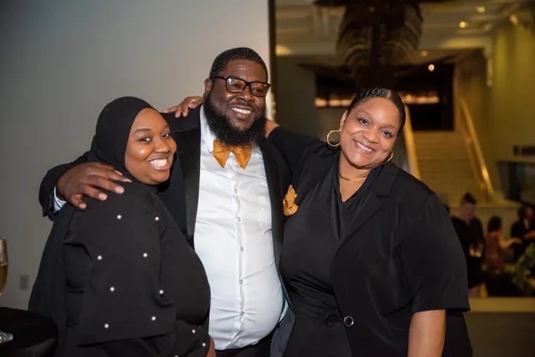 Sean Stallworth (center) poses at last year's Black Excellence in Birding gala. He still calls himself an "amateur" birder.