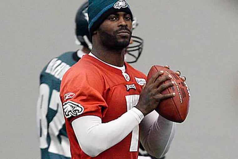 Michael Vick has not practiced with the Eagles since breaking two ribs against the Cardinals on Nov. 13. (David Maialetti/Staff Photographer)