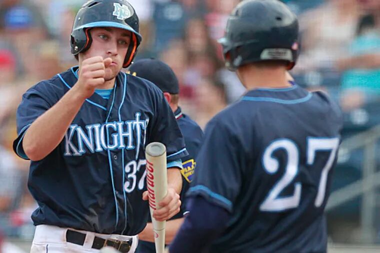 In the PIAA Class AAAA Baseball Final, Jake Schuster, left, of North
Penn is congratulated by teammate Mike Christy after scoring in the
2nd inning at Medlar Field at Lubrano Park on June 12, 2015. This gave
North Penn a 2-0 lead over Wyoming Valley.   (Charles Fox/ Staff
Photographer)