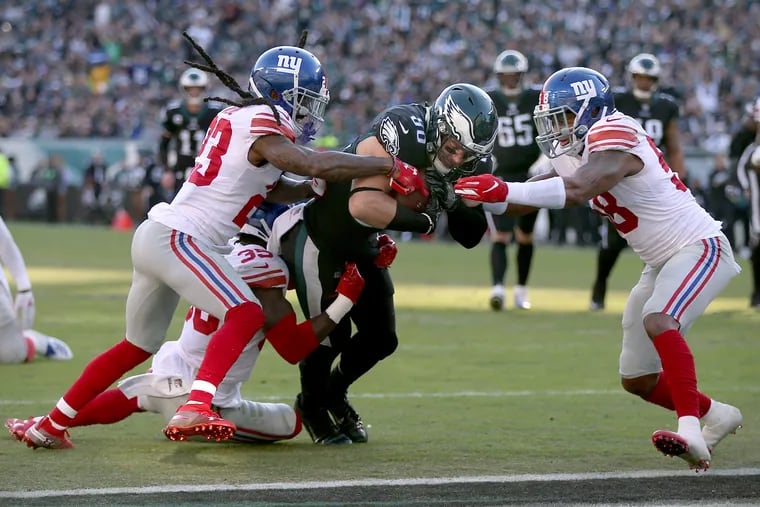 Eagles tight end Zach Ertz (86) scores a touchdown past New York Giants cornerbacks B.W. Webb (23) and Curtis Riley (35) and inside linebacker Tae Davis (58) in the second quarter of a game at Lincoln Financial Field in South Philadelphia on Sunday, Nov. 25, 2018. TIM TAI / Staff Photographer