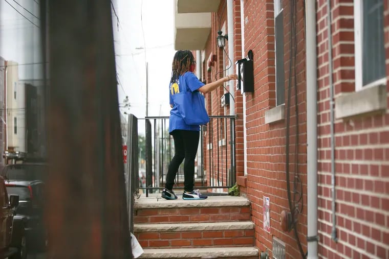 Alisha Mays knock on doors in North Philadelphia to incentivize people to get vaccinated. Philadelphia has seen disparities in vaccination between the city's wealthiest zip codes and its poorer ones.