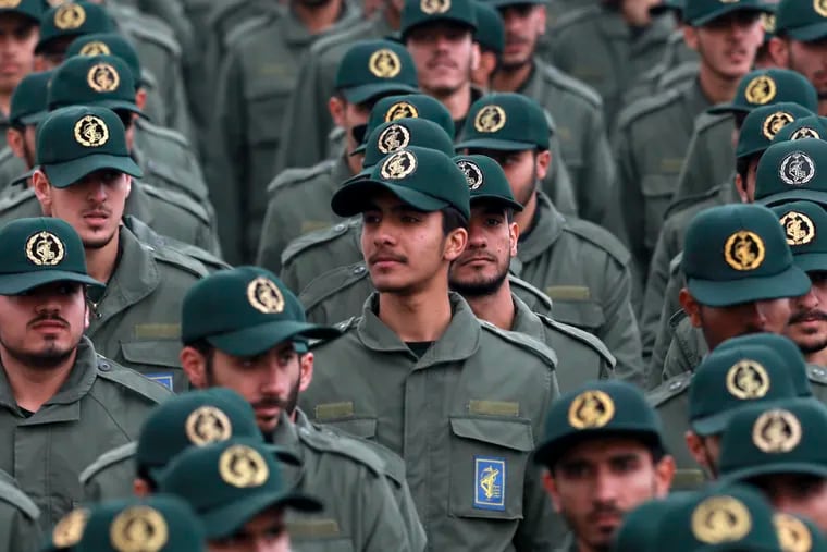 FILE - In this Feb. 11, 2019 file photo, Iranian Revolutionary Guard members attend a ceremony celebrating the 40th anniversary of the Islamic Revolution, at the Azadi, or Freedom, Square in Tehran, Iran. The Trump administration on Wednesday granted important exemptions to new sanctions on Iran’s Revolutionary Guard, watering down the effects of the measures while also eliminating an aspect that would have complicated U.S. foreign policy efforts.  (AP Photo/Vahid Salemi)