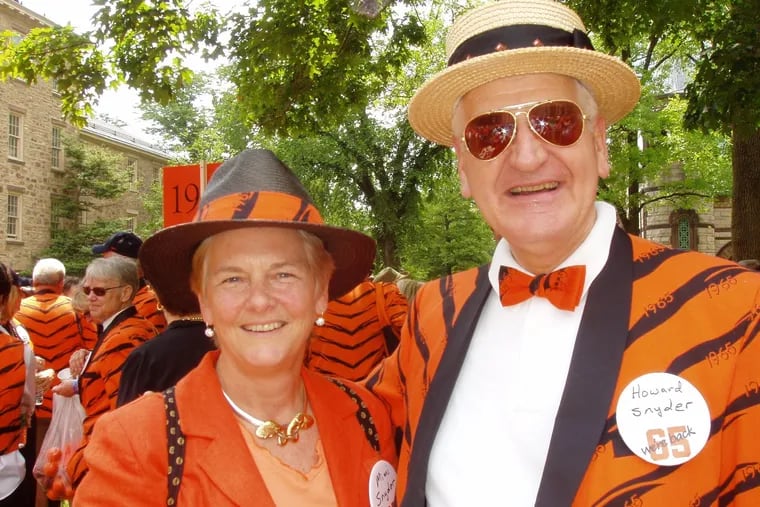 Dr. Snyder and his wife, Mimi, show their orange at this Princeton University reunion. Dr. Snyder was a pioneer in the field of pediatric urology who worked at Children's Hospital of Philadelphia.