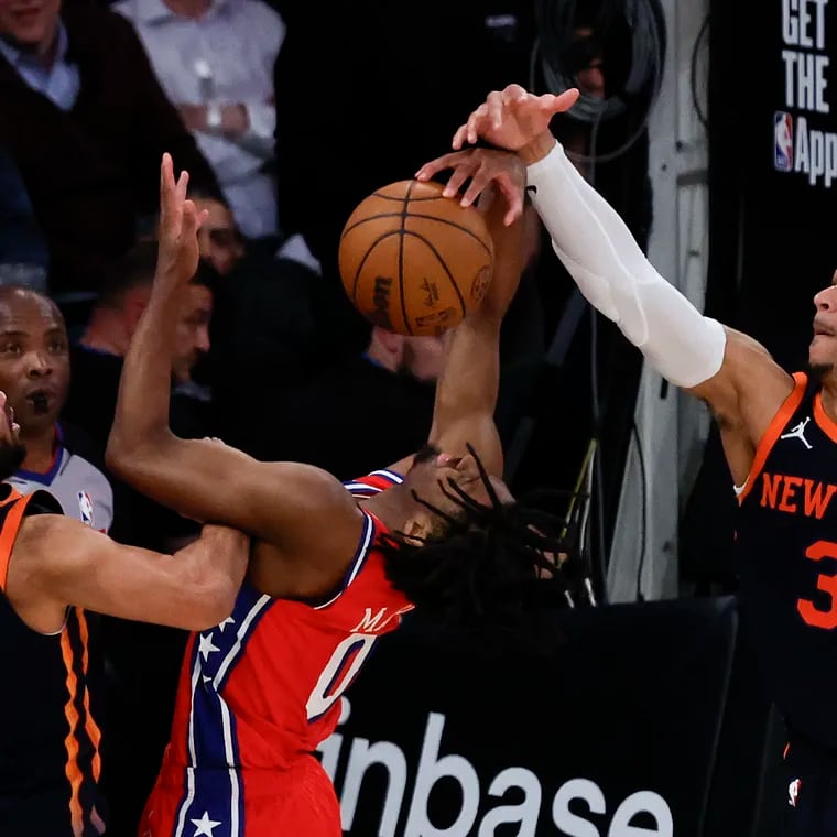 Sixers guard Tyrese Maxey tries to control the inbounds pass against New York Knicks guard Jalen Brunson and forward Josh Hart late in the fourth quarter of Game 2.
