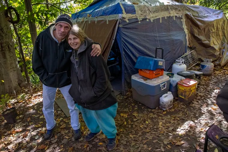 David Renner and wife Shirley Pierson, married for 17 years, live homeless in a tent beside railroad tracks in a ridge over Stony Creek in Norristown.